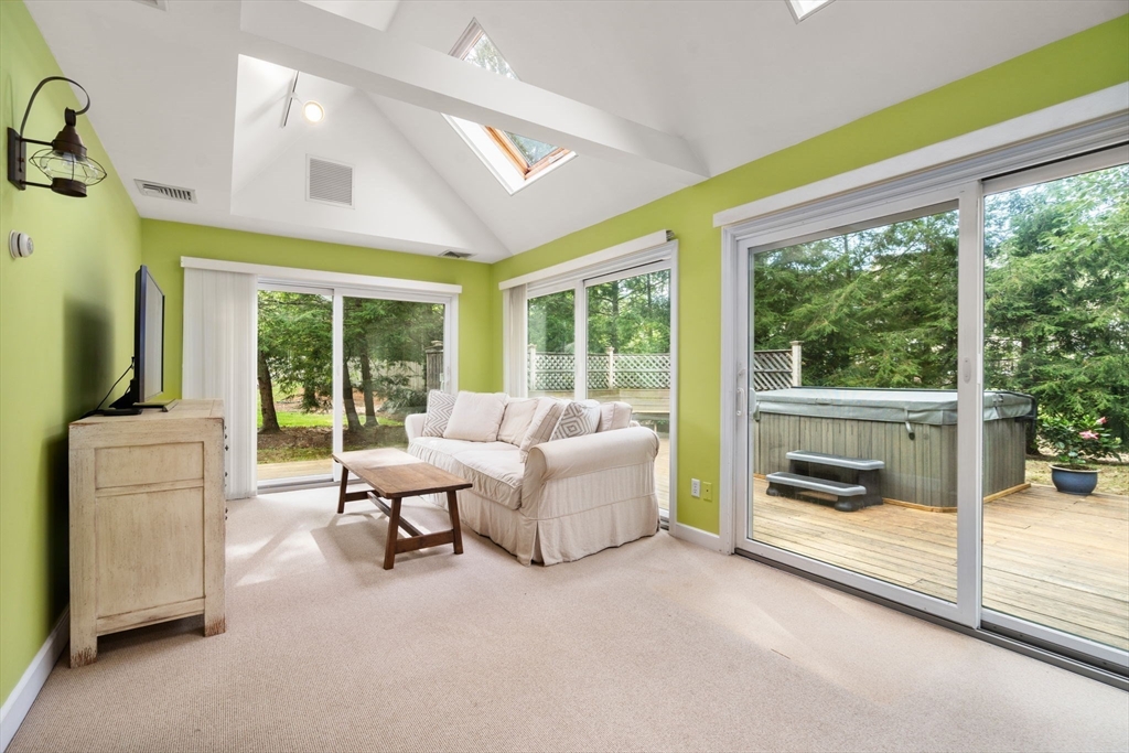9 Arbor Circle Natick, MA 01760 - Photo 12 of 34 a living room with furniture and a floor to ceiling window