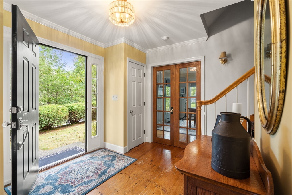 9 Arbor Circle Natick, MA 01760 - Photo 16 of 34 a view of an entryway and livingroom with furniture