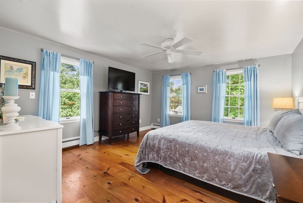 9 Arbor Circle Natick, MA 01760 - Photo 18 of 34 a bedroom with a bed dresser and a window