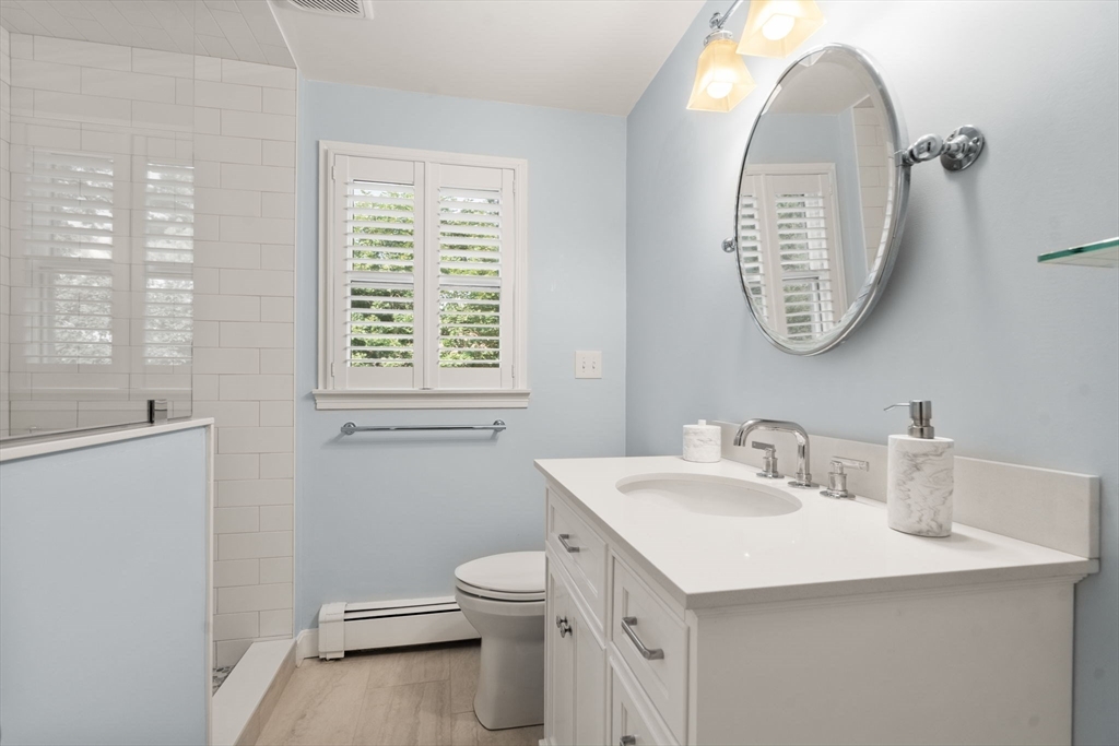 9 Arbor Circle Natick, MA 01760 - Photo 19 of 34 a bathroom with a sink and a toilet