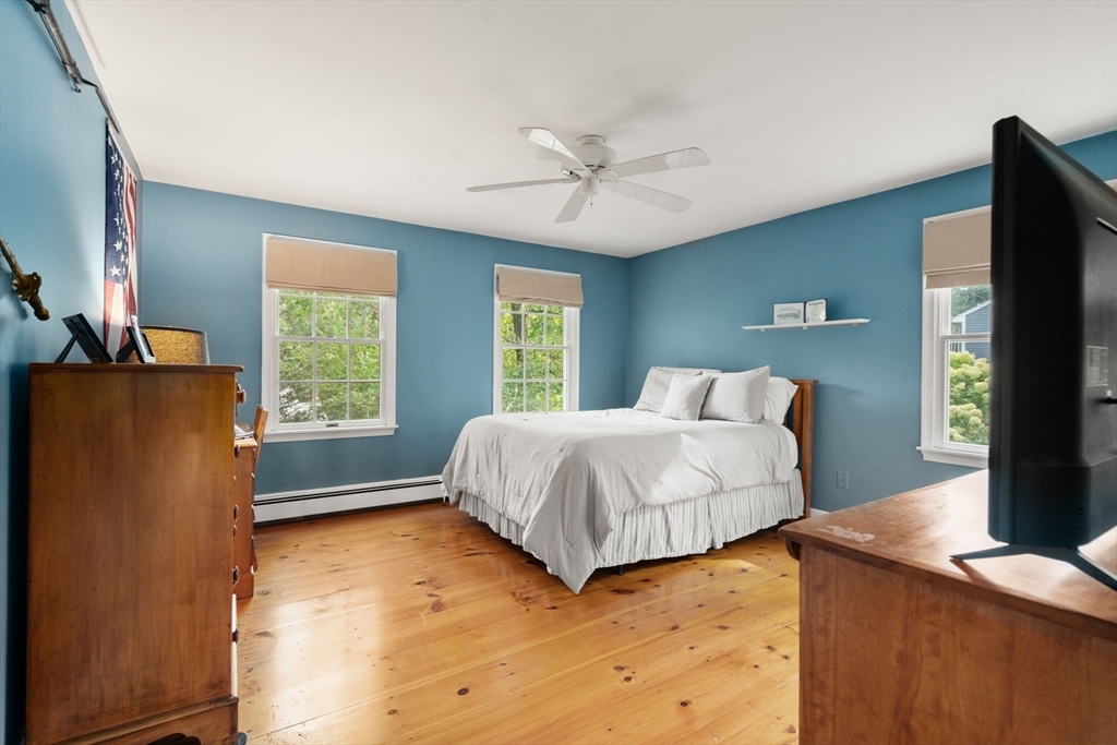 9 Arbor Circle Natick, MA 01760 - Photo 21 of 34 a bedroom with a bed and a flat tv screen on dresser