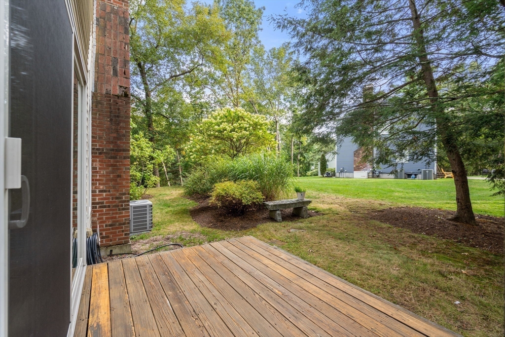 9 Arbor Circle Natick, MA 01760 - Photo 30 of 34 a view of a backyard with wooden floor