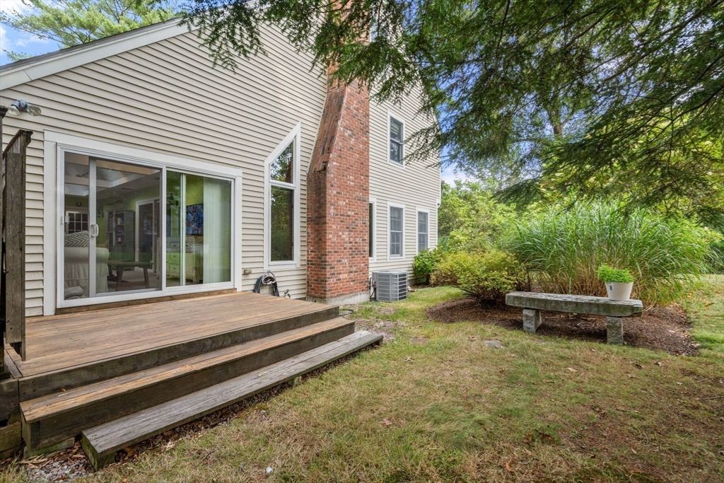 9 Arbor Circle Natick, MA 01760 - Photo 31 of 34 a view of a house with backyard and sitting area