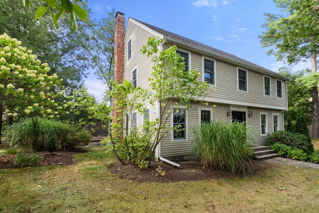 9 Arbor Circle Natick, MA 01760 - Photo 4 of 34 a view of a house with a yard and sitting area