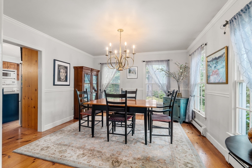9 Arbor Circle Natick, MA 01760 - Photo 7 of 34 a view of a dining room with furniture and wooden floor