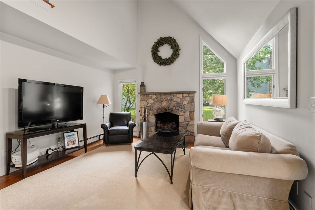9 Arbor Circle Natick, MA 01760 - Photo 9 of 34 a living room with furniture and a flat screen tv