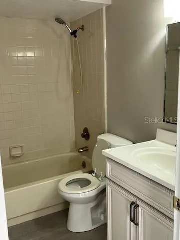 a bathroom with a sink a toilet and a bathtub