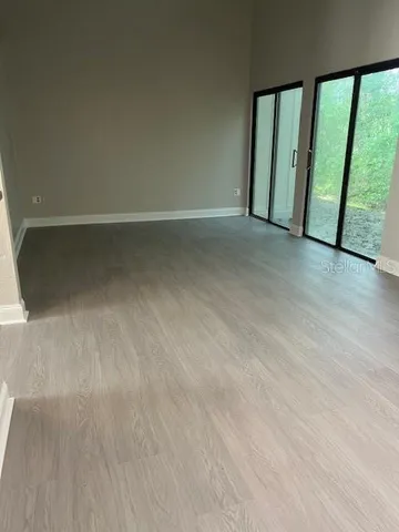 a view of an empty room with a window