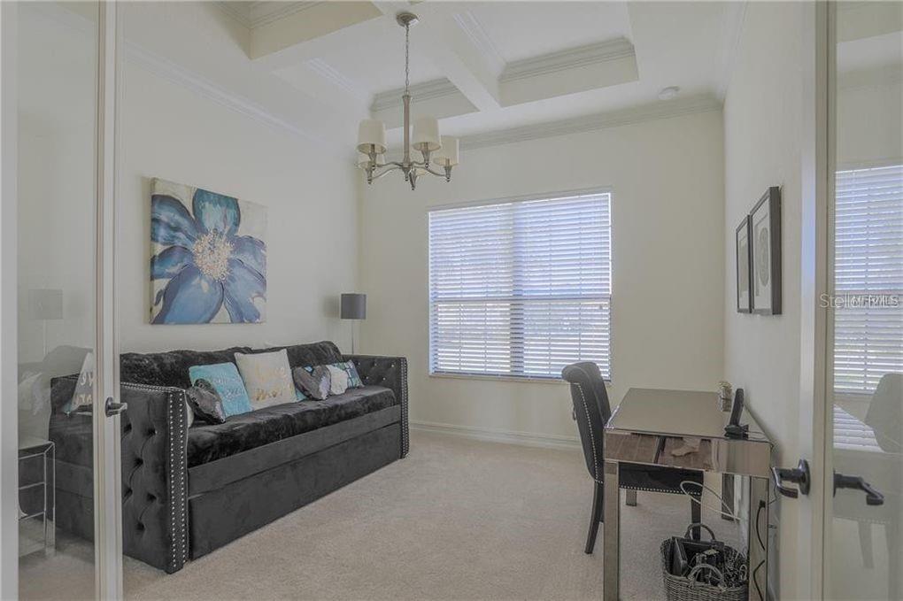 5528 Arnie Loop Lakewood Ranch, FL 34211 - Photo 25 of 59 a living room with furniture and a window