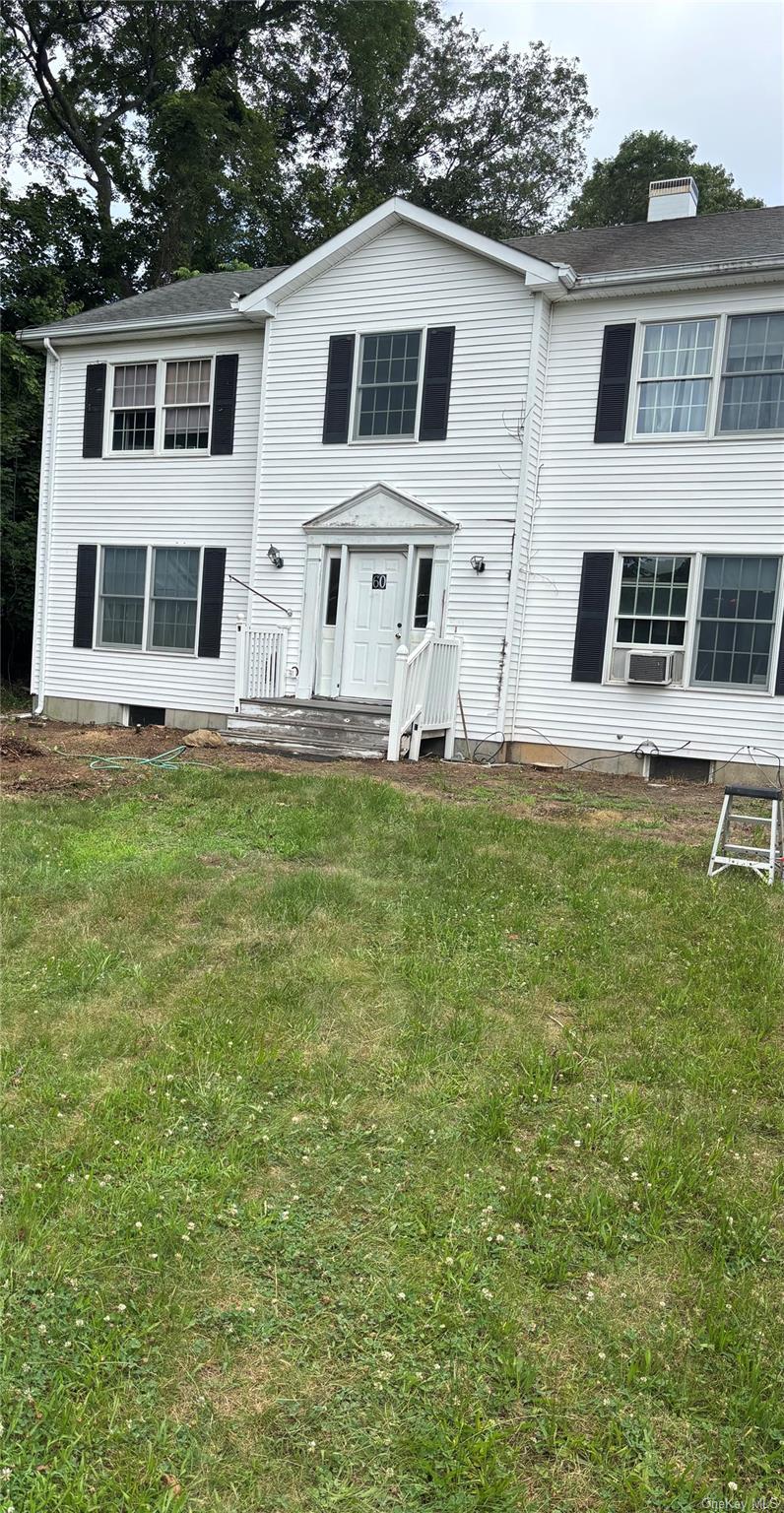 Colonial with generous landing/porch.