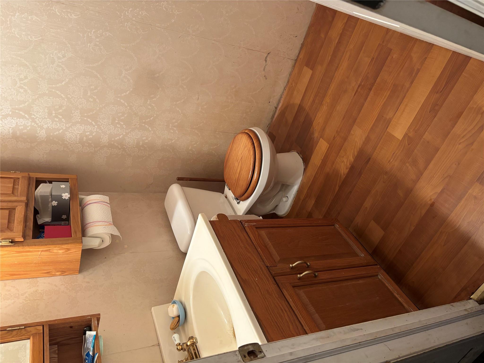 60 Randall Road Wading River, NY 11792 - Photo 14 of 14 a bathroom with a toilet a sink and mirror