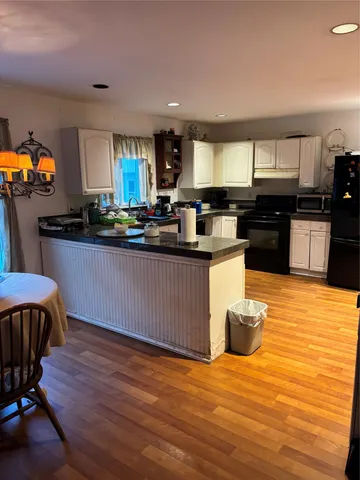 a kitchen with stainless steel appliances granite countertop a sink counter space and cabinets