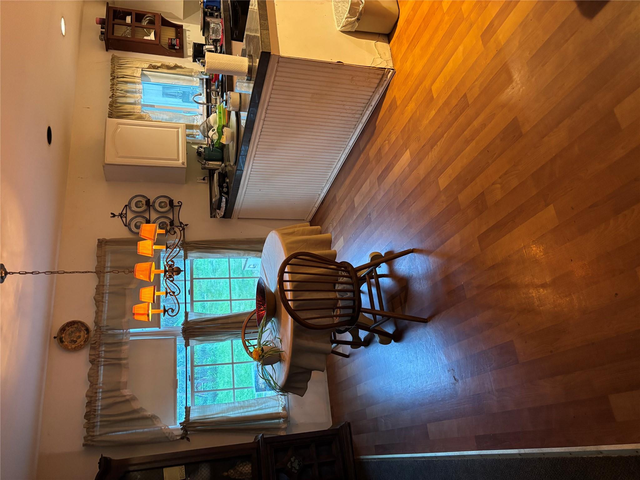 60 Randall Road Wading River, NY 11792 - Photo 4 of 14 a kitchen with stainless steel appliances granite countertop a stove and a wooden floor