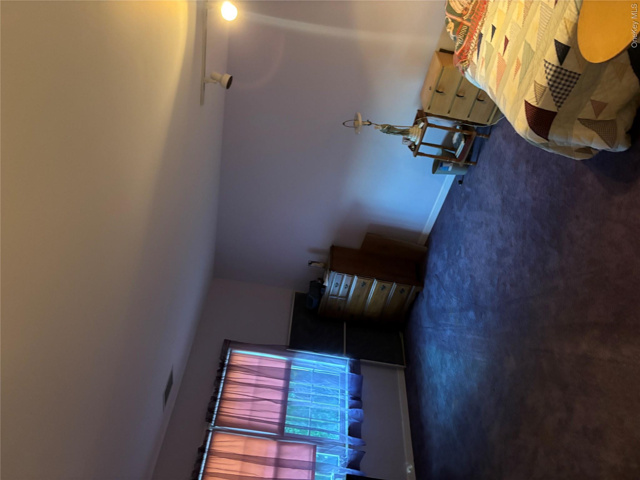60 Randall Road Wading River, NY 11792 - Photo 5 of 14 Bedroom featuring dark carpet and baseboards