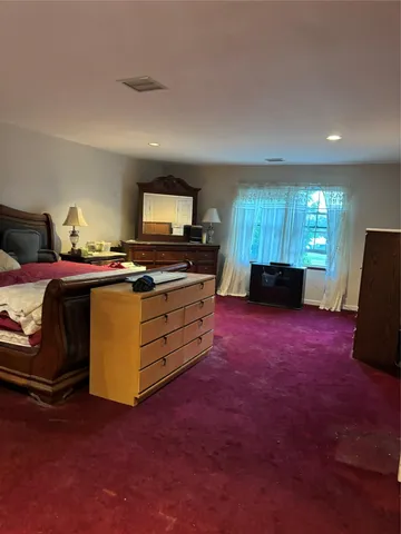 a kitchen with kitchen island granite countertop furniture a sink and a stove
