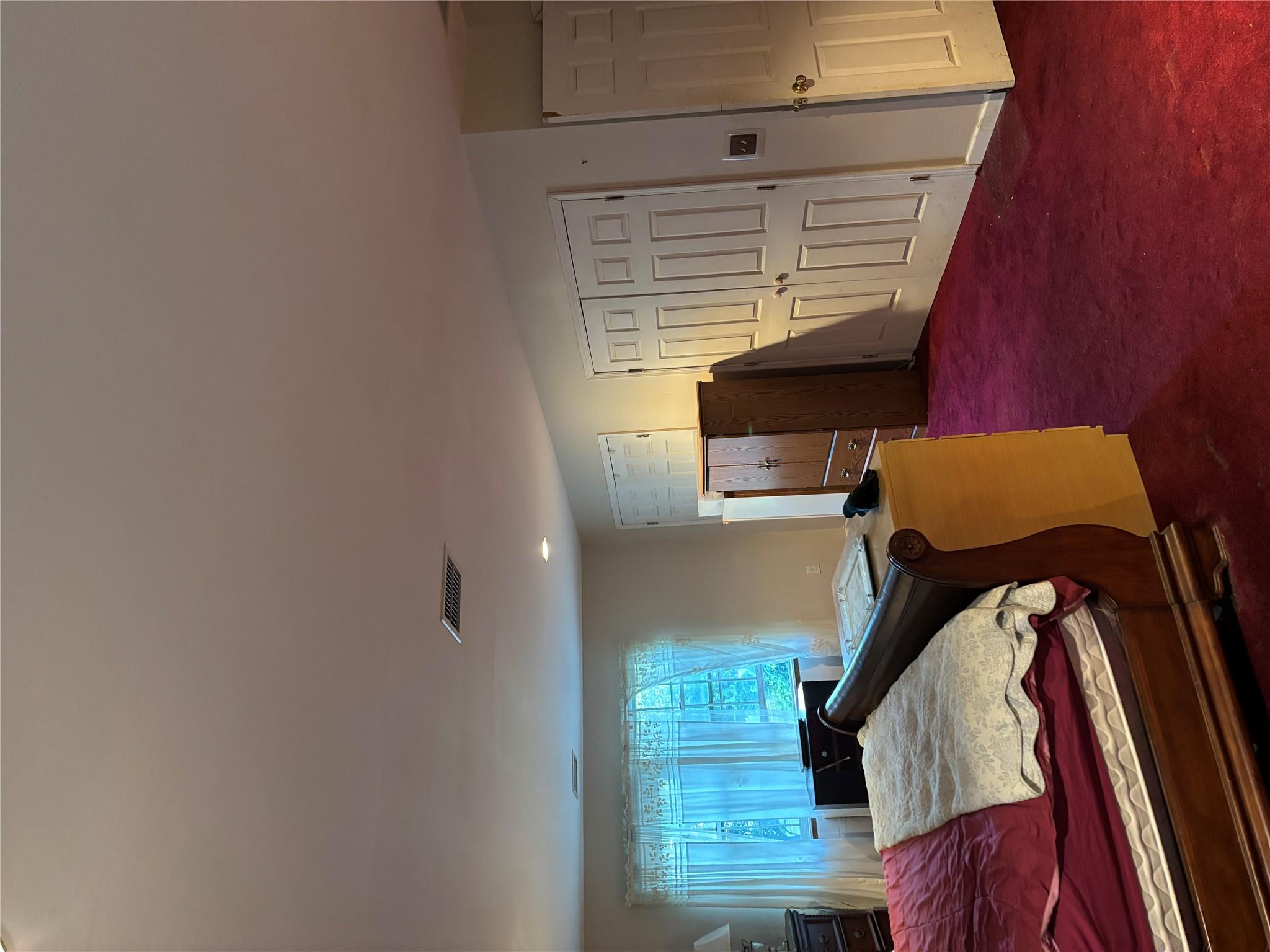 60 Randall Road Wading River, NY 11792 - Photo 9 of 14 a bed room with a bed furniture and a window