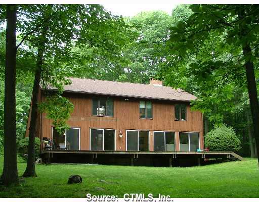 82 Ruggles Road Guilford, CT 06437 - Photo 1 of 1 a front view of a house with a yard