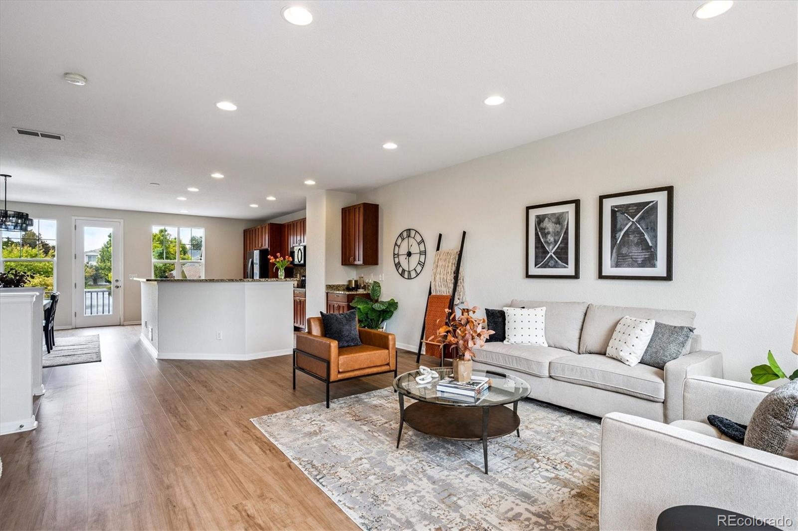 11815 Stuart Place Westminster, CO 80031 - Photo 13 of 36 a living room with furniture and a wooden floor