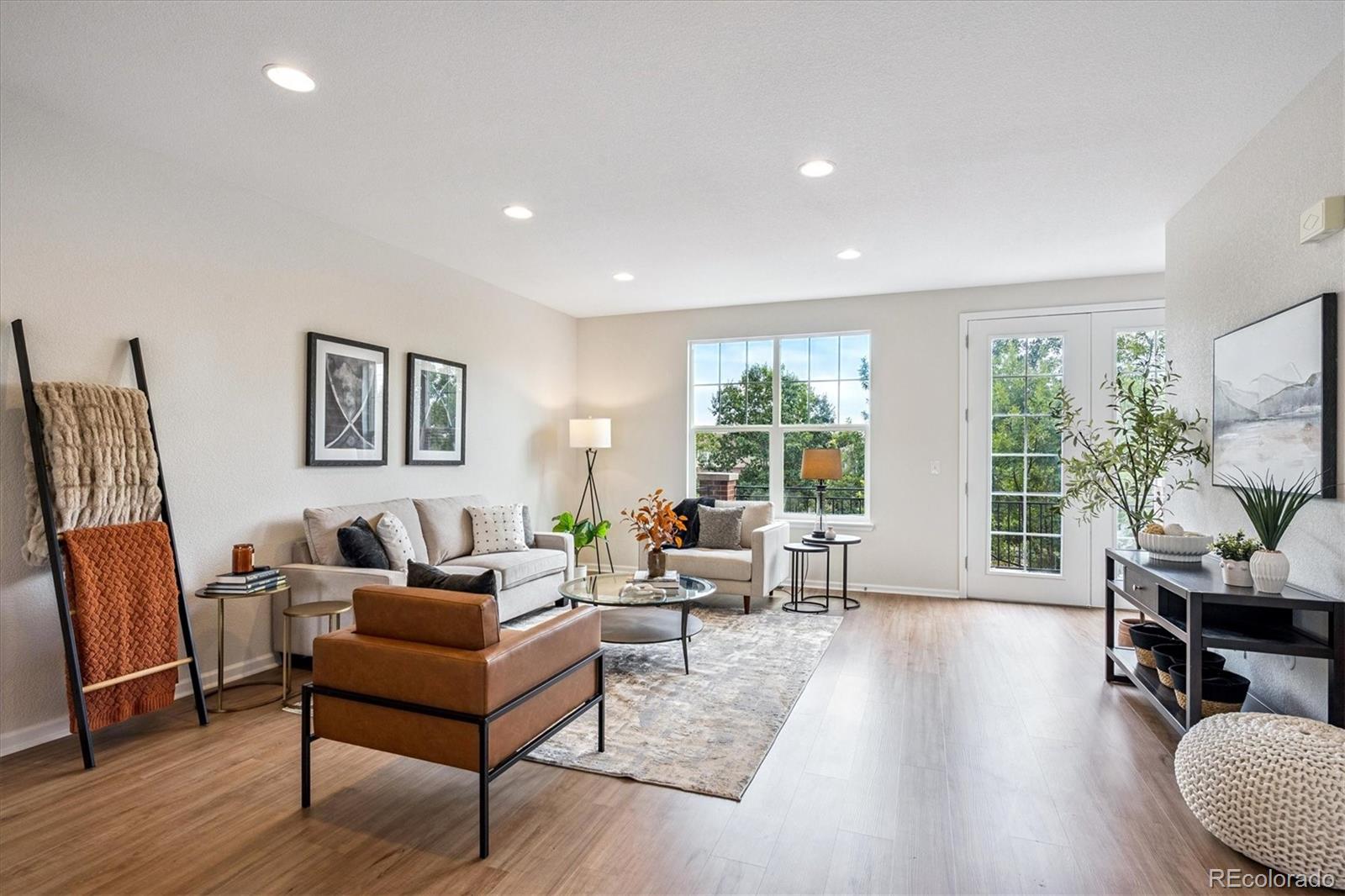 11815 Stuart Place Westminster, CO 80031 - Photo 14 of 36 a living room with furniture and a wooden floor
