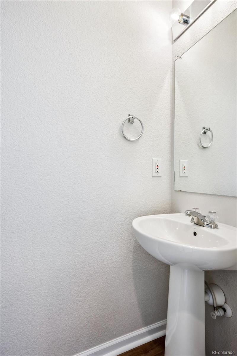11815 Stuart Place Westminster, CO 80031 - Photo 18 of 36 a bathroom with a sink and a mirror