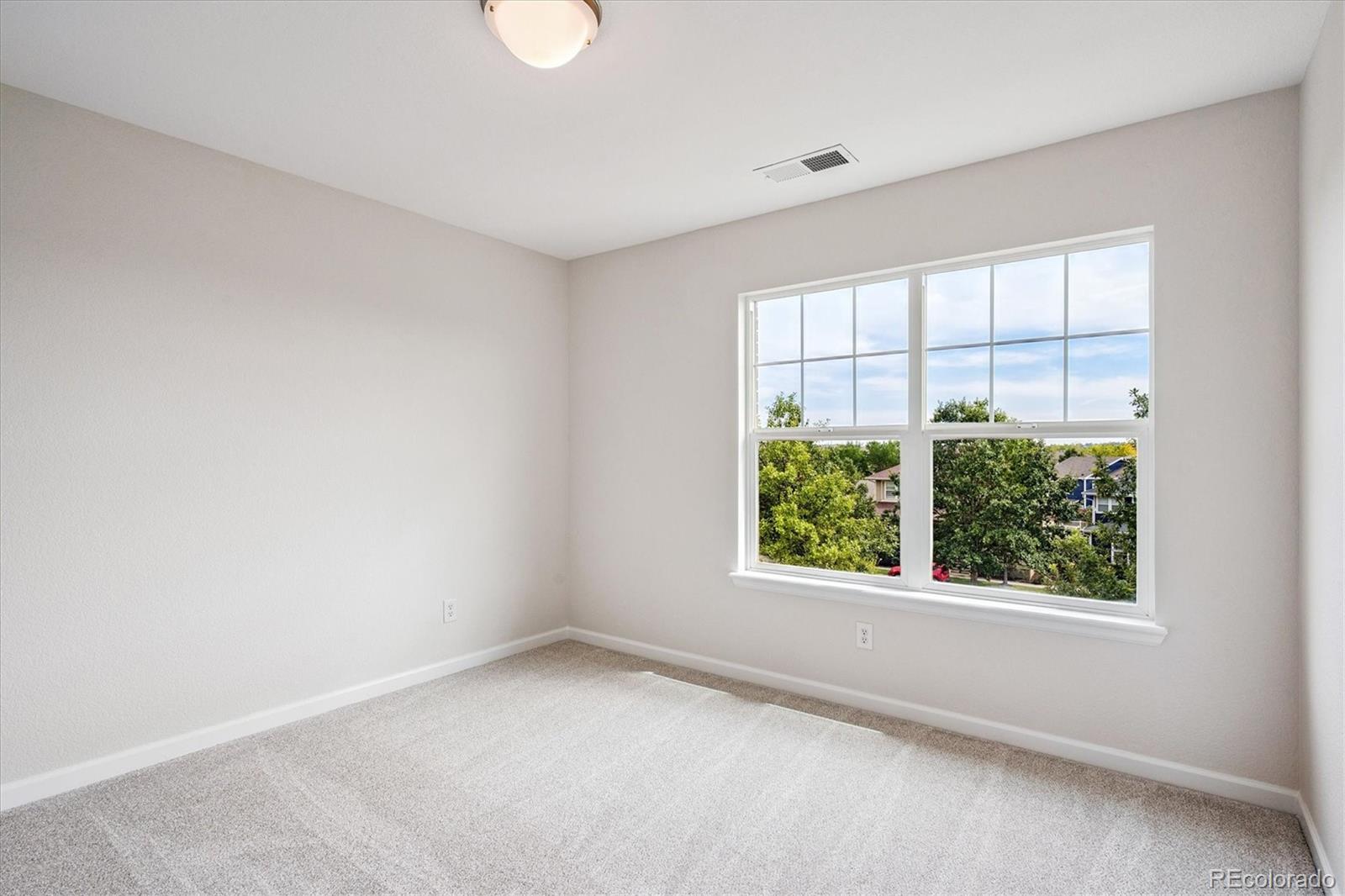 11815 Stuart Place Westminster, CO 80031 - Photo 24 of 36 an empty room with windows