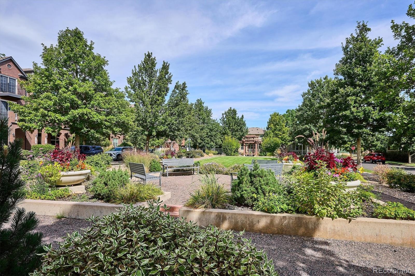 11815 Stuart Place Westminster, CO 80031 - Photo 32 of 36 a view of a lake with a building in the background