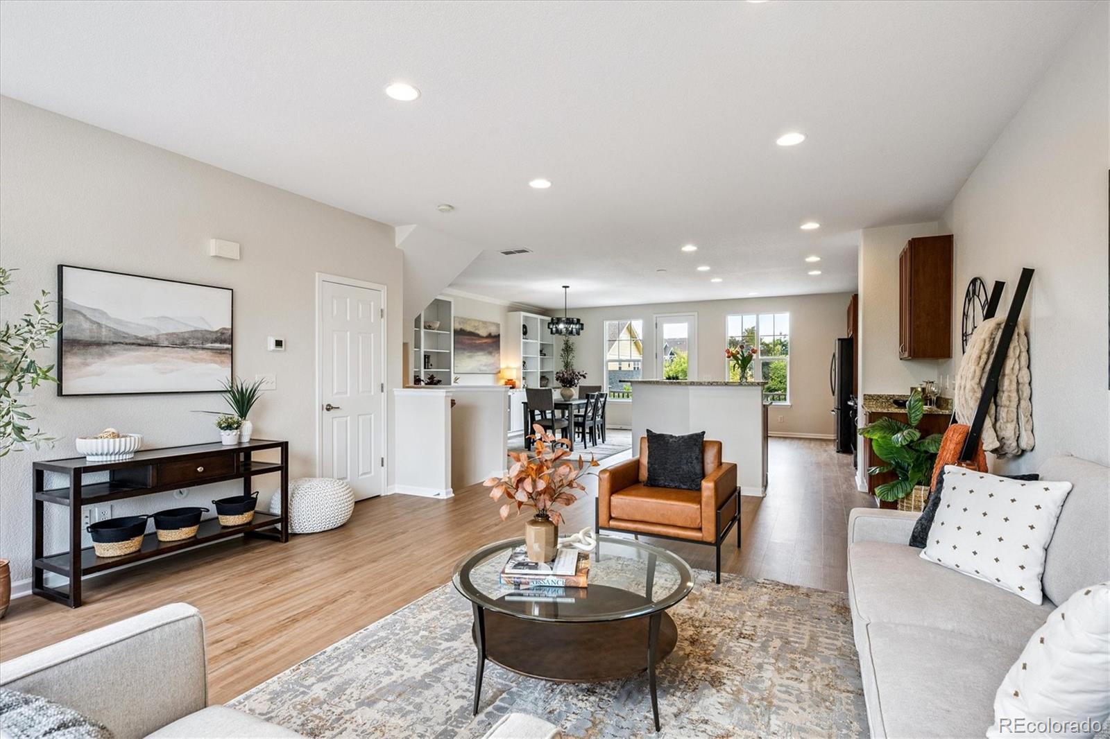 11815 Stuart Place Westminster, CO 80031 - Photo 4 of 36 a living room with furniture and a wooden floor