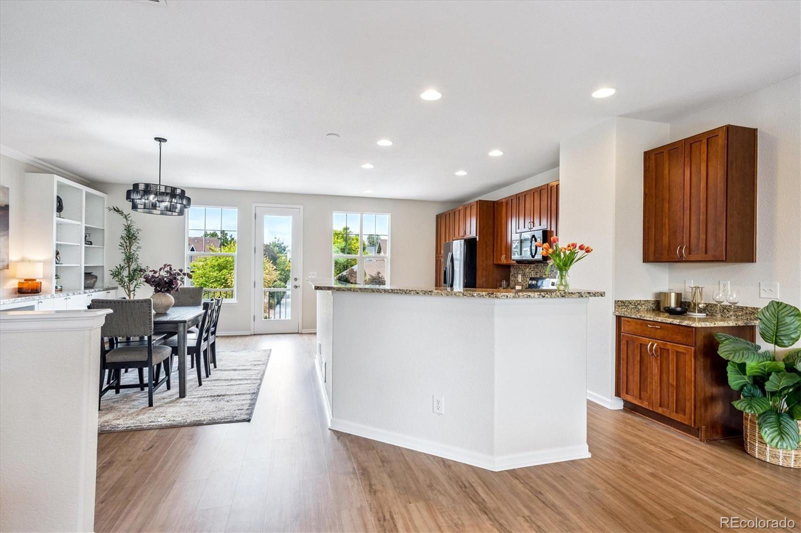 11815 Stuart Place Westminster, CO 80031 - Photo 5 of 36 a view of a kitchen with dining table and chairs