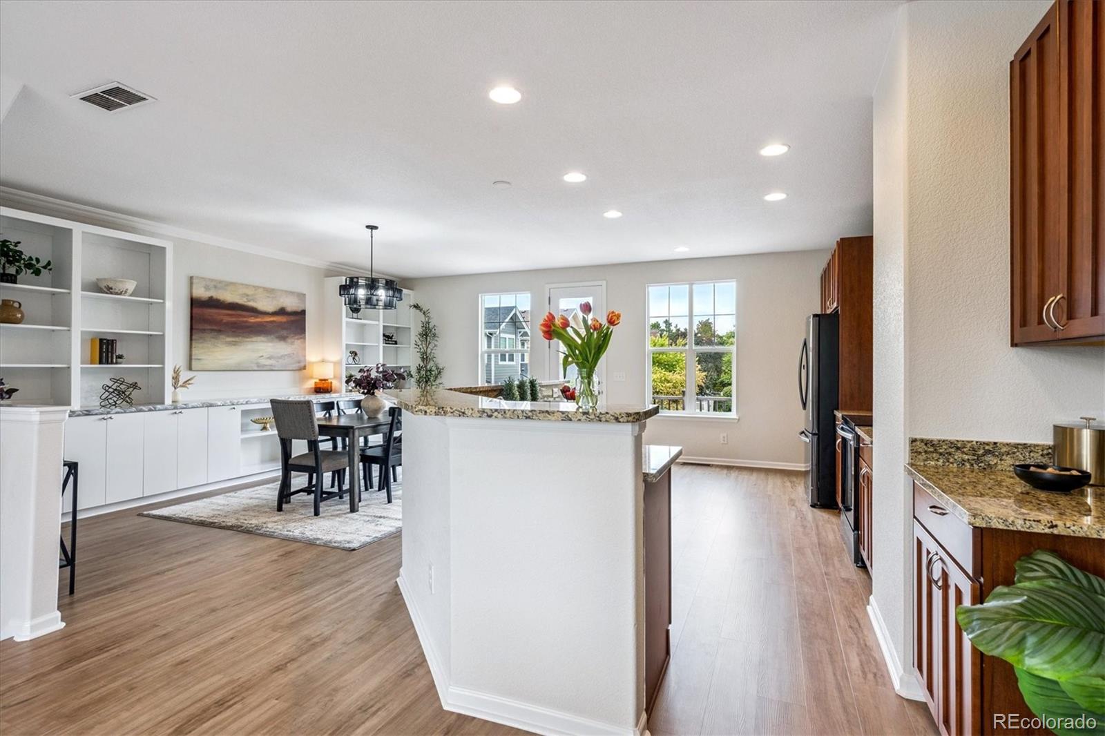 11815 Stuart Place Westminster, CO 80031 - Photo 6 of 36 a view of a kitchen and dining room
