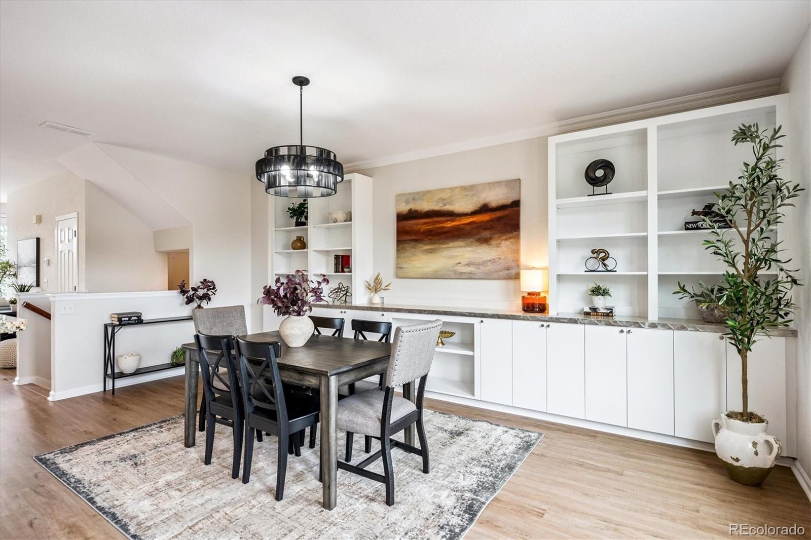 11815 Stuart Place Westminster, CO 80031 - Photo 10 of 36 a view of a dining room with furniture and wooden floor