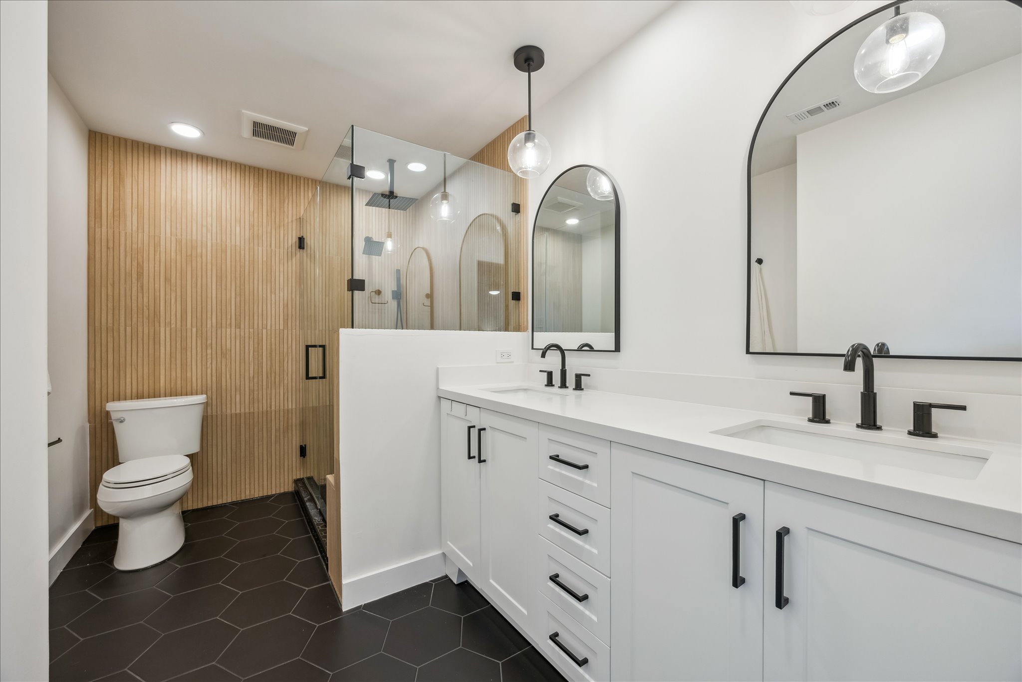 12935 Pegasus Street Austin, TX 78727 - Photo 3 of 38 Recently updated primary bathroom has double sinks and a huge walk in shower