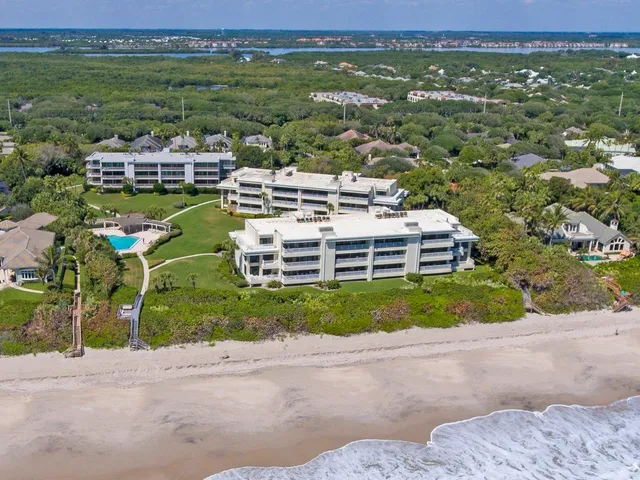 an aerial view of a house with a garden