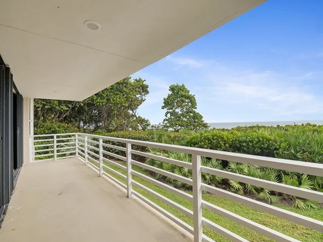 a view of a balcony with an outdoor space