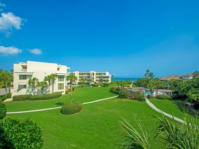 a flower garden with a fountain