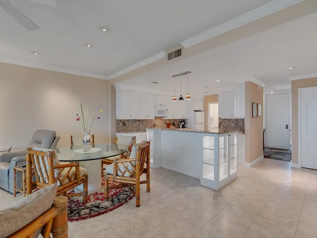 a view of a kitchen and dining room