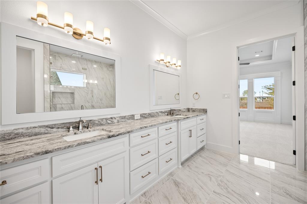 229 Bel Grand Road Haslet, TX 76052 - Photo 28 of 37 a bathroom with double sink and a mirror
