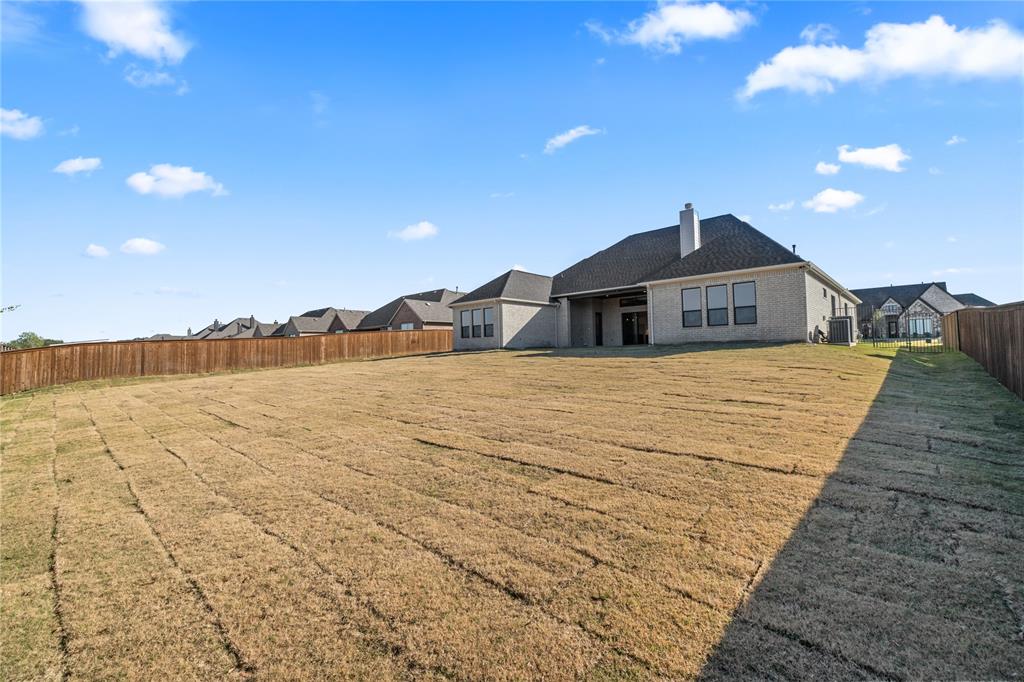 229 Bel Grand Road Haslet, TX 76052 - Photo 35 of 37 a view of a house with a yard