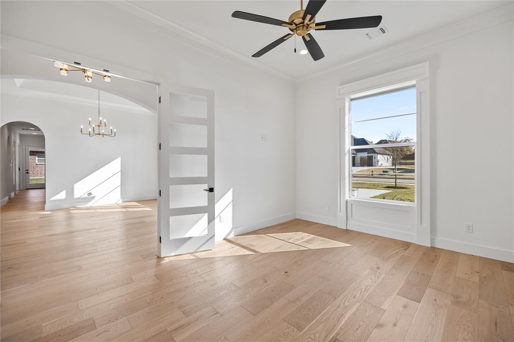 229 Bel Grand Road Haslet, TX 76052 - Photo 5 of 37 a view of empty room with wooden floor and fan