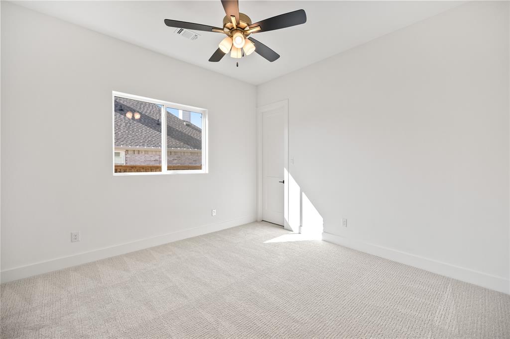 229 Bel Grand Road Haslet, TX 76052 - Photo 7 of 37 an empty room with windows and fan
