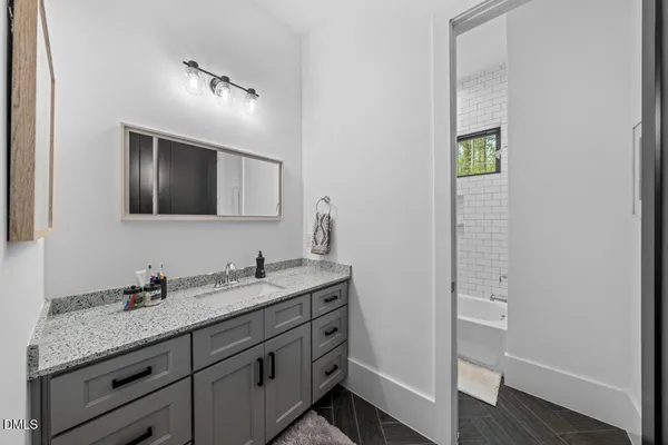 a bathroom with a sink and bathtub