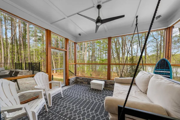 a room with water heater and a floor to ceiling window