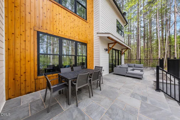 a view of a patio with a table and chairs