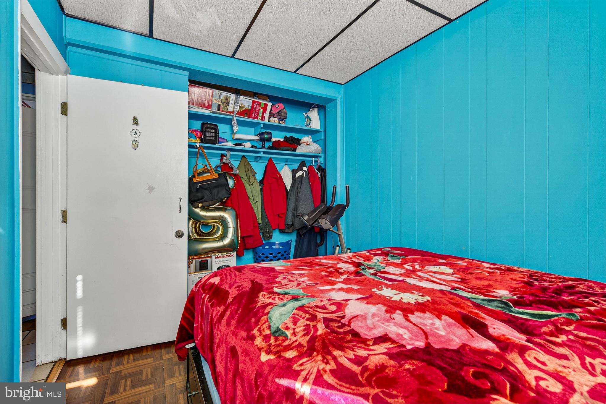 1109 Quantril Way Baltimore, MD 21205 - Photo 10 of 18 Vibrant blue room with cozy charm.