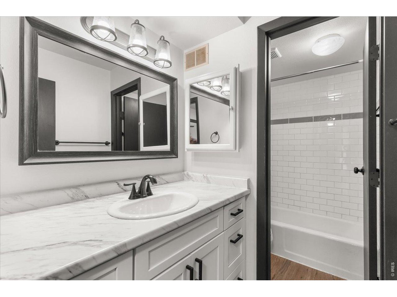 1625 West Elizabeth Street, Unit 2 Fort Collins, CO 80521 - Photo 19 of 29 a bathroom with a sink and a mirror