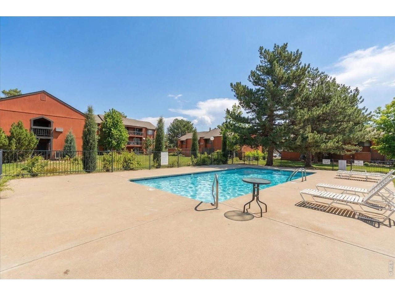 1625 West Elizabeth Street, Unit 2 Fort Collins, CO 80521 - Photo 24 of 29 a view of a swimming pool with a yard