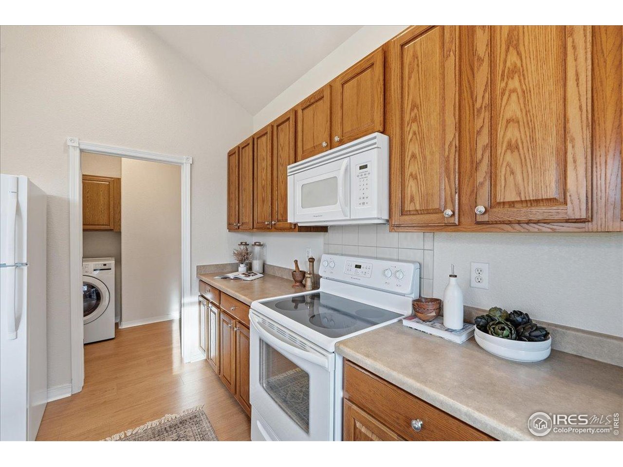 2287 Trestle Road Fort Collins, CO 80525 - Photo 18 of 40 a kitchen with stainless steel appliances granite countertop a sink microwave and cabinets