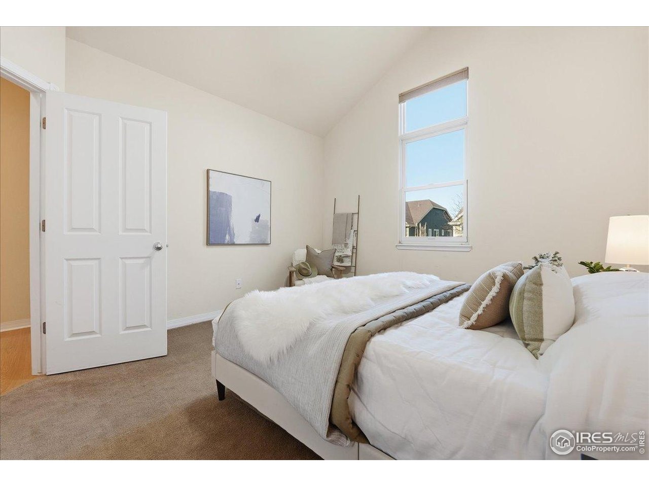 2287 Trestle Road Fort Collins, CO 80525 - Photo 22 of 40 a bedroom with a bed and a painting