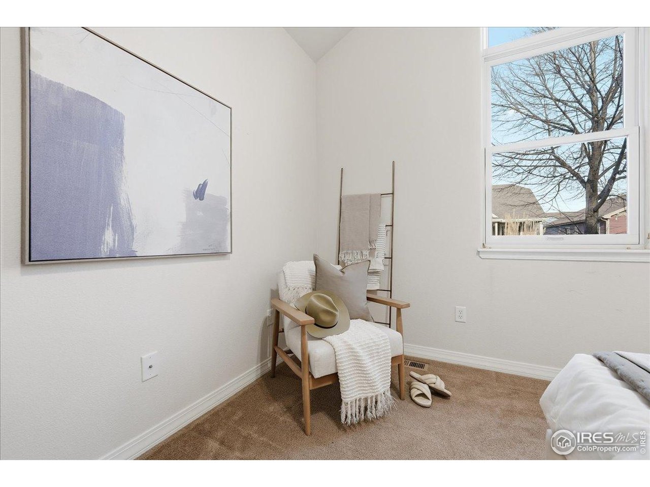 2287 Trestle Road Fort Collins, CO 80525 - Photo 24 of 40 a chair and table in a room