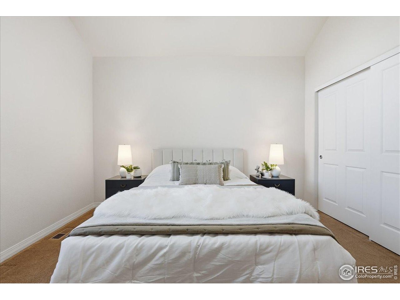2287 Trestle Road Fort Collins, CO 80525 - Photo 25 of 40 a bedroom with a bed and a lamp