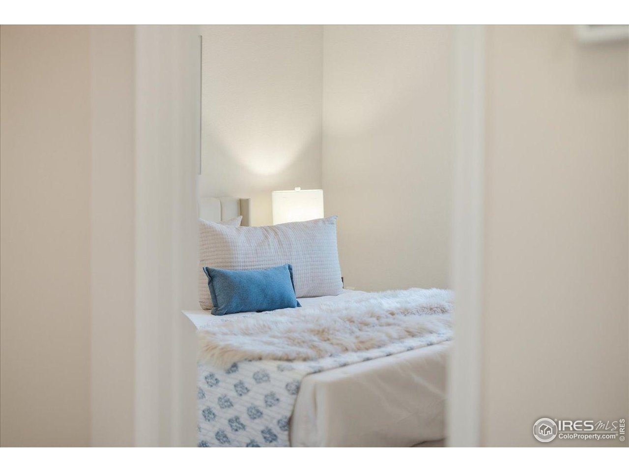 2287 Trestle Road Fort Collins, CO 80525 - Photo 26 of 40 a bedroom with a bed and a night stand